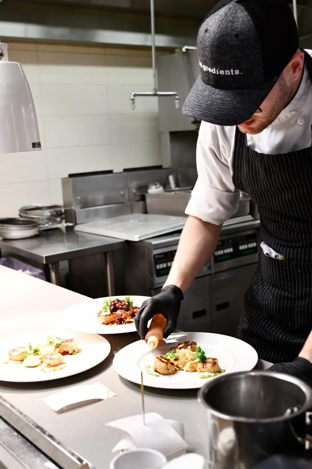 A cook in our cozy kitchen, arranging the vegetables and enjoying the process of making a delicious meal.